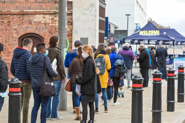 Queues form outside the Historic Dockyard on the first weekend after lockdown. Picture: Mike Cooter (220521)