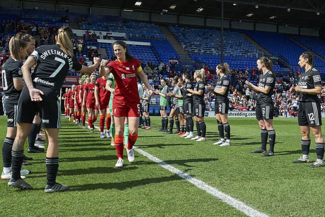 BIRKENHEAD, ENGLAND - APRIL 24: (THE SUN OUT, THE SUN ON SUNDAY OUT) Captain Niamh Fahey of Liverpool leads her team on to the pitch to a guard of honour by the Sheffield United players before the Barclays FA Women's Championship match between Liverpool and Sheffield United at Prenton Park on April 24, 2022 in Birkenhead, England. (Photo by Nick Taylor/Liverpool FC/Liverpool FC via Getty Images)