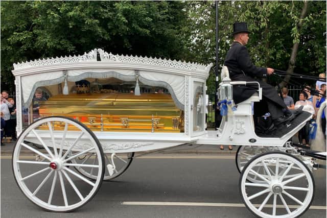 Mr Collins' gold casket makes its final journey through Sheffield.