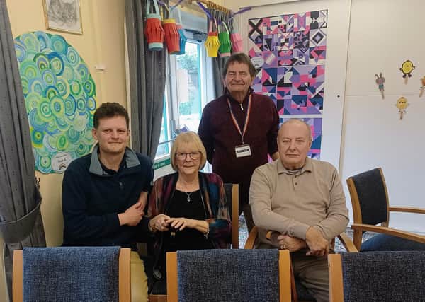 Cllr Rob Reiss and Cllr Alan Woodcock with residents of the care home at the 50th anniversary event.