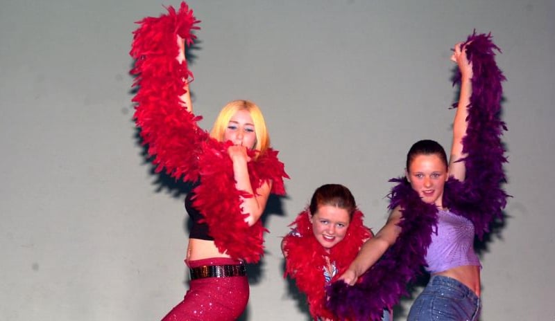Dancers at the Myriad of Dance show in 2001 dancing with feather boas.