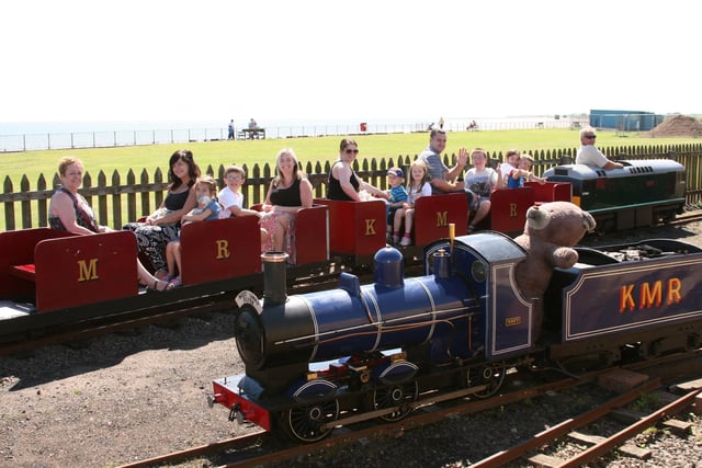 Norrie Sneddon driving a diesel locomotive behind the The West Links Flyer steam train