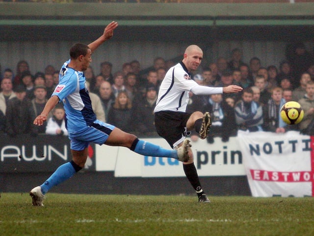 Alistair Asher plays the ball out of defence.