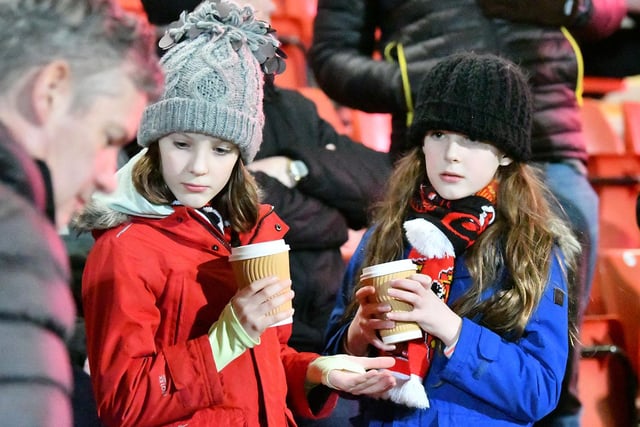 Two young Sunderland fans take in the scenes at Cheltenham Town.