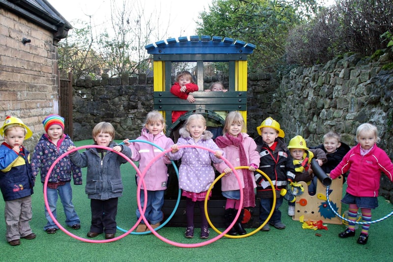 Children at Cromford Playgroup enjoy their new play area in 2009.