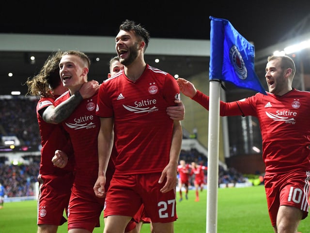 Aberdeen dumped Rangers out of the cups twice in one season as goals from Niall McGinn and Connor McLennan won this replay at Ibrox.