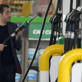 Star readers reveal what they are paying at the pump as the price soars to new record. (AP Photo/Frank Augstein)