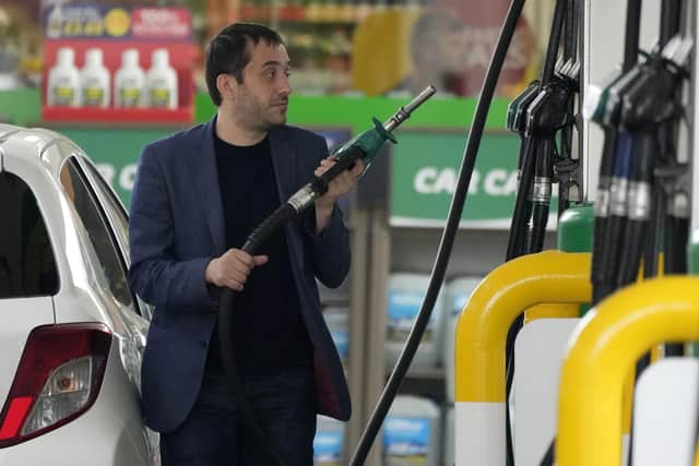 Star readers reveal what they are paying at the pump as the price soars to new record. (AP Photo/Frank Augstein)
