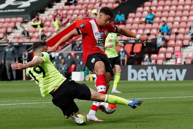 Che Adams battles for possession with Sheffield United's Jack Robinson during the Premier League fixture at Southampton: Andrew Boyers/Pool via Getty Images