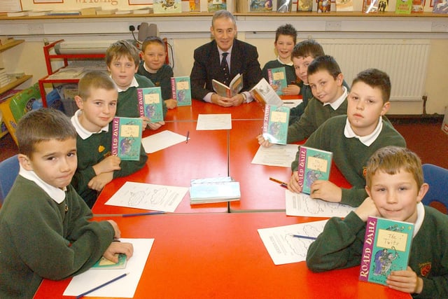 These pupils at Broadway Juniors look like they are enjoying their reading session with acting director of education Terry Walsh. Were you in the picture in 2005?