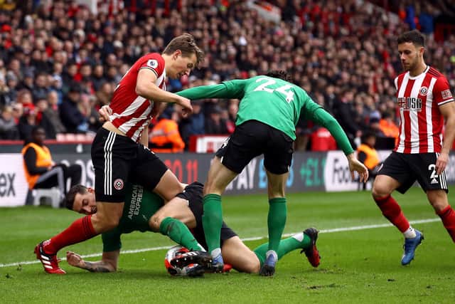 Sheffield United's Sander Berge (left) and Brighton and Hove Albion's Lewis Dunk battle for the ball during the Premier League match at Bramall Lane, Sheffield: Tim Goode/PA Wire.