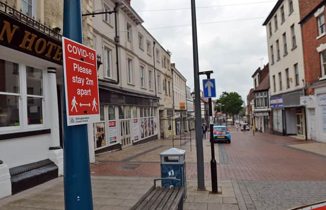 Signs warn shoppers to stay two metres apart