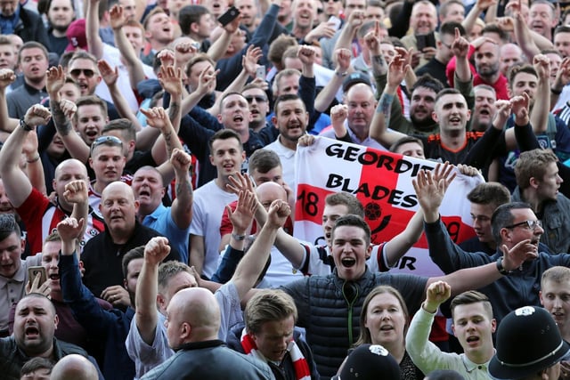 Sheffield United fans celebrating their side's promotion to the Championship 