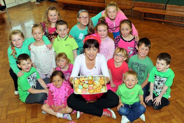 Golden Flatts primary school high level teacher Claire Skilbeck with pupils dressed in pink and green. It's a charity fundraiser in 2013 but what are your memories of it?