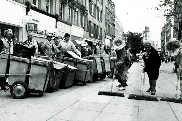 Councillor Mrs Phyllis Smith, chairman of the City Council's Health and Consumer Services Committee, helped by two clowns, launches Operation Spring Clean in Fargate, Sheffield, May 11, 1987