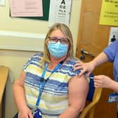 Karen Ford, A Sheffield health and social care worker receiving the vaccine from Janice Wake, health care assistant at Sheffield Vaccination centre at Matthews Practice.