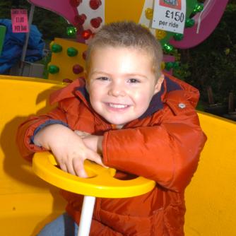 Three year old Liam-Thomas Westmoreland enjoying the tea cup ride at Bentley's Party in the Park, October 2007.