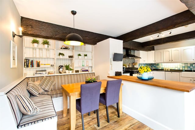 In the kitchen there's also an informal dining space with built-in bench seating.