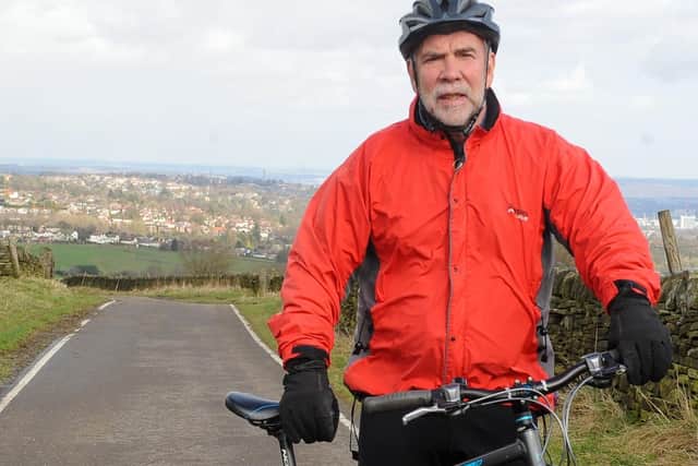 David Grundy on his bike in Sheffield, he is hoping to cycle to paris in the summer after recovering from a stroke last year which left him locked in and only capable of communicating with his eyes