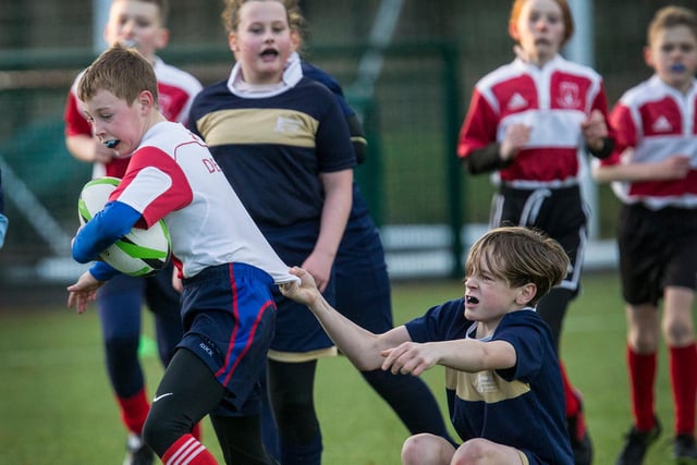 Burnfoot Primary's Leo Lawrie catching hold of a Denholm opponent
