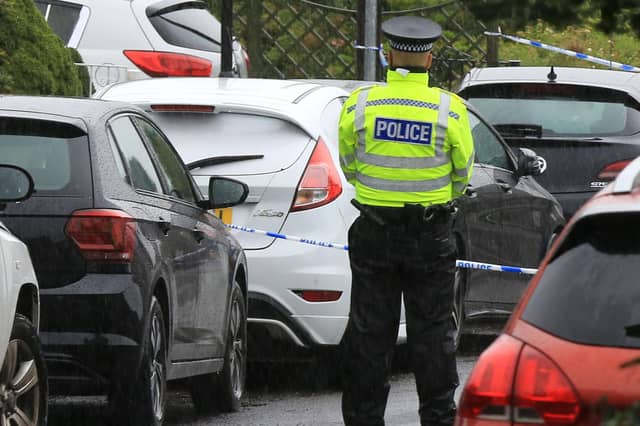 Police at the scene of a incident on Lump Lane in Grenoside.