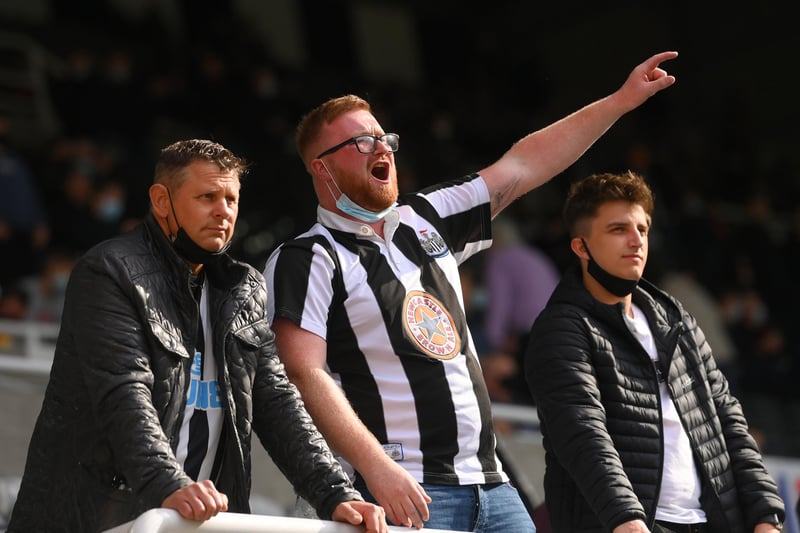 A Newcastle fan sings from the Gallowgate end during the Premier League match between Newcastle United and Sheffield United at St James Park.