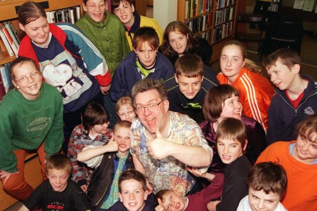 Famous poet Ian McMillan in Sprotbrough Library with children from Anchorage School in 1999.