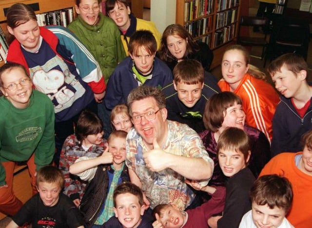Famous poet Ian McMillan in Sprotbrough Library with children from Anchorage School in 1999.