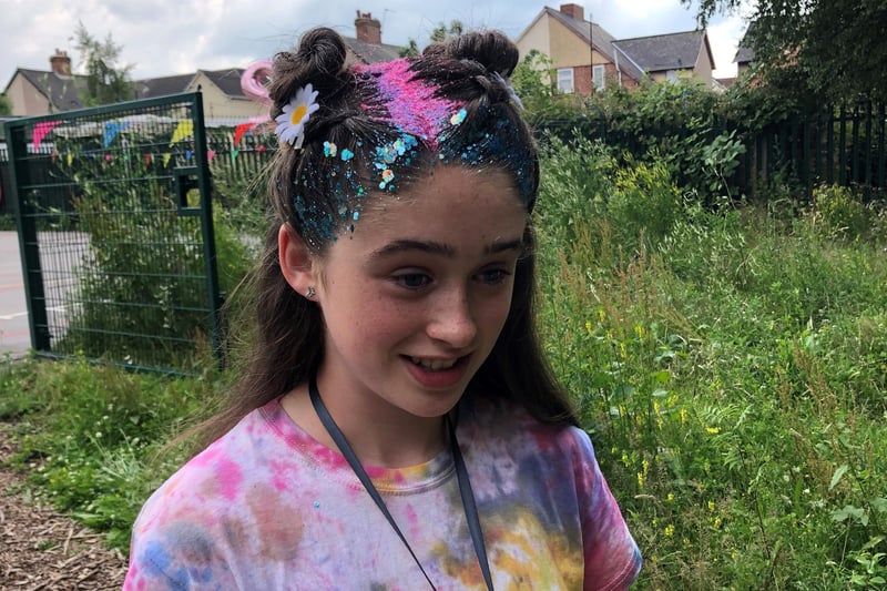 Rebecca Calladine from Saks hair salon treated pupils and teachers to festival style hair at Oak Fest at Our Lady of Sorrows Catholic Primary School