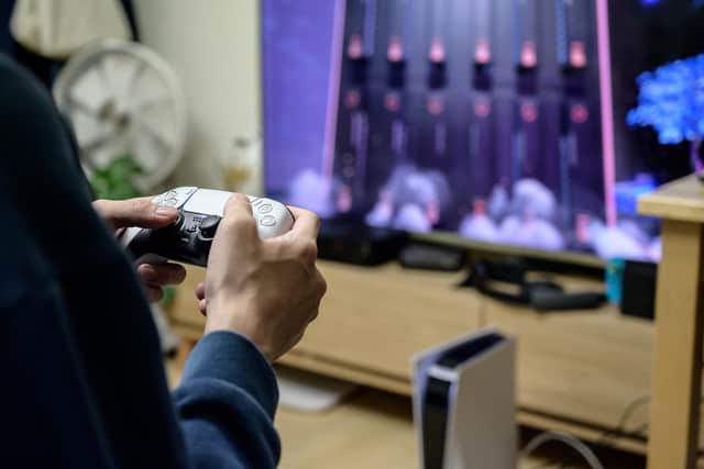 A gamer plays on the new Sony PlayStation PS5. (Photo by YELIM LEE/AFP via Getty Images)