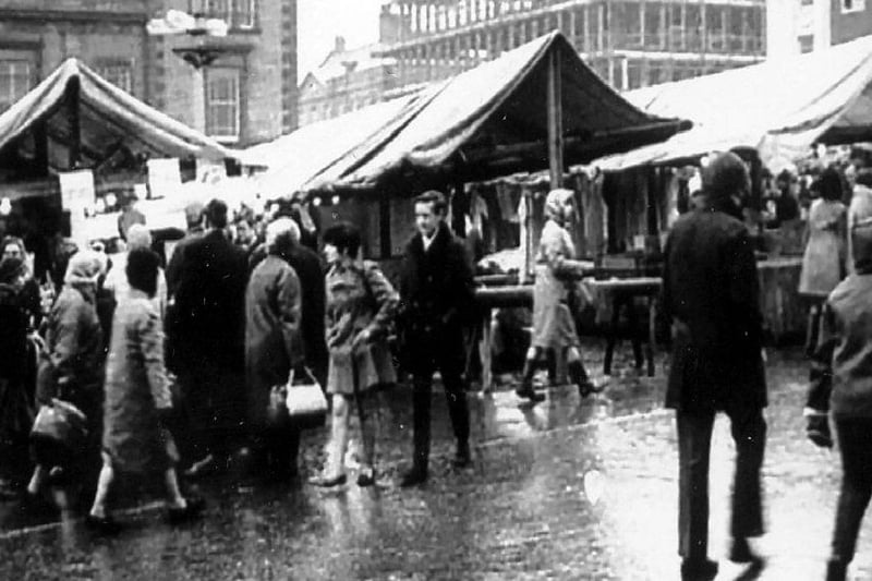 A bustling market scene from yesteryear