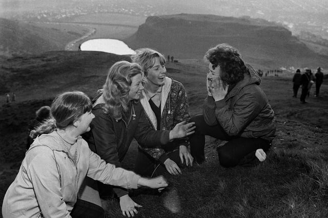 Four girls are pictured washing their faces in the dew as the sun comes up on Arthur's Seat on May Day morning in 1965. According to tradition, the practice means the person will have a clear complexion for the rest of the year.