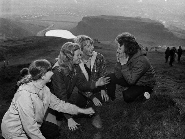 Four girls are pictured washing their faces in the dew as the sun comes up on Arthur's Seat on May Day morning in 1965. According to tradition, the practice means the person will have a clear complexion for the rest of the year.