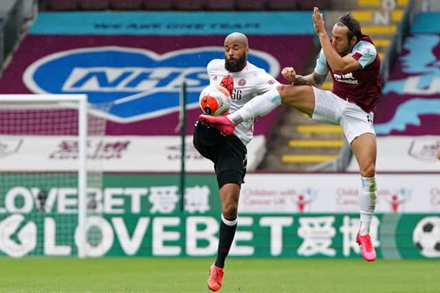 David McGoldrick and Josh Brownhill battle for the ball in Sheffield United's draw with Burnley at Turf Moor (Photo by JON SUPER/POOL/AFP via Getty Images)