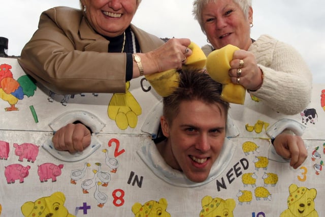 Stocks for Children in Need at T G B Training   l to r Patricia Pointon, Michael Bass and Margaret Pearson pictured in 2007
