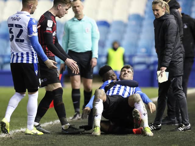 Hartlepool United's Mike Fondop-Talom appeared to have Sheffield Wednesday's Callum Paterson in a headlock. (Credit: Will Matthews | MI News)