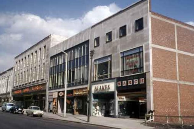 British Home Stores and other shops on The Moor, in Sheffield city centre, in 1962, including L. Blake Ltd, childrens outfitters, and March the Tailor