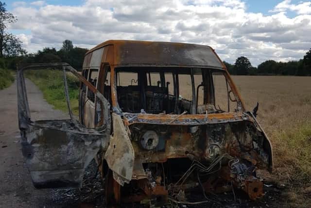 The minibus - found in Wigan burnt-out with its engine missing