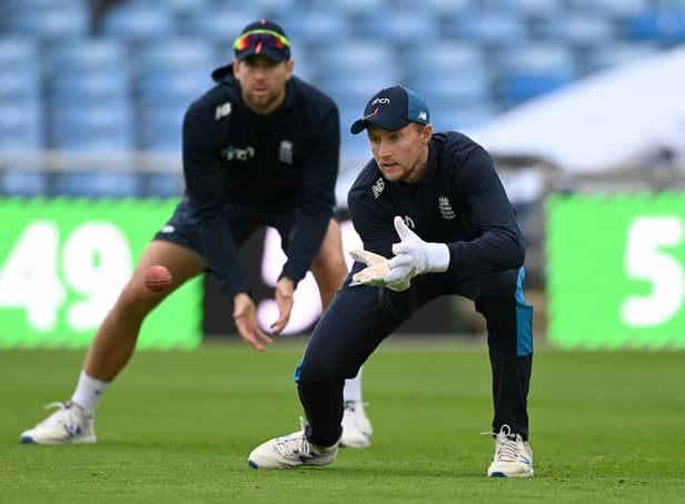 England captain Joe Root catches watched by Dawid Malan during a nets session at Emerald Headingley Stadium on Tuesday.