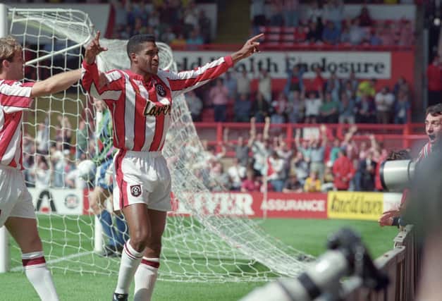 Brian Deane celebrates scoring the first Premier League goal back in 1992, against Manchester United