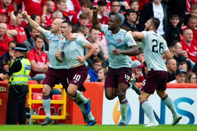 Who scored the winning goal in Hearts' first league win of the campaign?