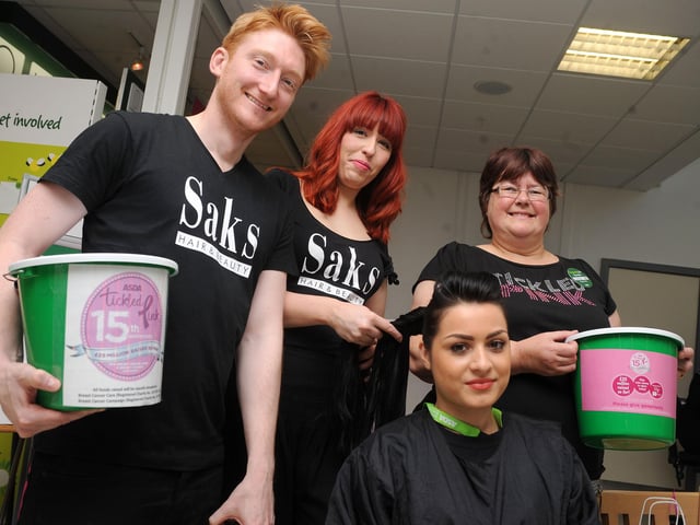Ruksanna Hussain (centre front), of Doncaster has her hair platted for the Tickled Pink Cancer Charity, by Rebecca Green, of SAKS Hairdressing, with Paul Calladine, of SAKS Hairdressing and Carolyn Halls, of ASDA, at ASDA in 2011