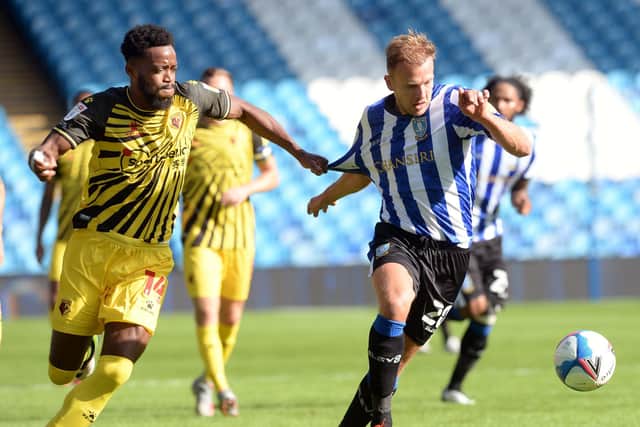 Watfords Nathaniel Chalobah tries to pull back Sheffield Wednesday's Jordan Rhodes when the sides met earlier in the season.  Pic Steve Ellis