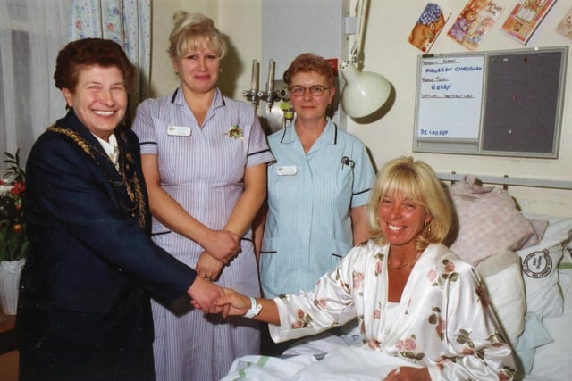 The Mayor of Doncaster, Councillor Maureen Edgar met Mexborough Montagu Hospital patient Maureen Chadburn in 2000. Looking on are  staff nurse Beverley Beal and healthcare assistant Christine Jeeves.
Staff and mums enjoying fun and games at the Sure Start end of year party at Denaby's Milestone pub.