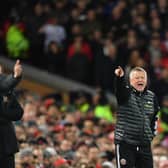 Liverpool's German manager Jurgen Klopp (L) and Sheffield United's English manager Chris Wilder during January's match at Anfield: PAUL ELLIS/AFP via Getty Images