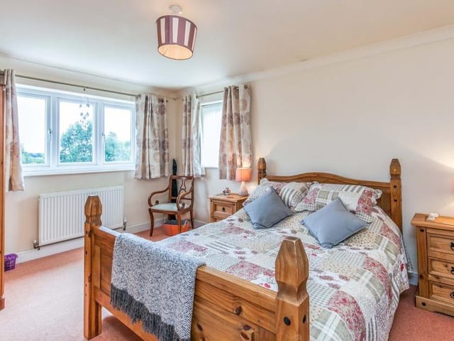 The master bedroom is bright and oozing comfort, with double-glazed windows, a central heating radiator and coving to the ceiling. Its en suite is fitted with a shower, wash hand basin and low-level WC.