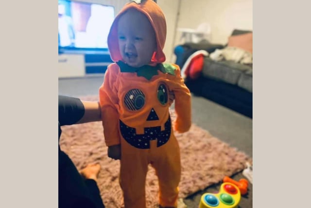 Kaiden Wales, age 23 months, shows off his pumpkin onesie. Thanks to Deborah Shaw for the picture.