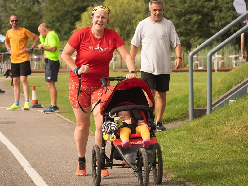 Helen Brandt pushes baby Erin around the Portsmouth Lakeside event. Picture: Keith Woodland (140821-85)