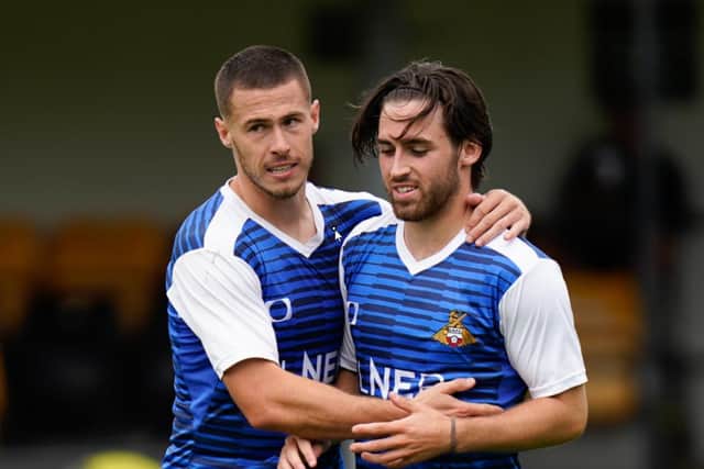 Doncaster ROvers will likely be without left-back Tommy Rowe (left) for their trip to Sheffield Wednesday this weekend.