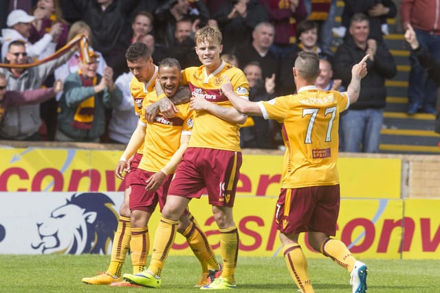 Lionel Ainsworth of Motherwell celebrates his goal, making it 2-0, with team-mates during the Scottish Premiership play-off final second leg versus Rangers at Fir Park on May 31, 2015. (Photo by Jeff Holmes/Getty Images)